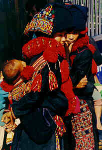 Yao Woman with her Baby, Yao Village in Chiang Rai Province, Northern Thailand.